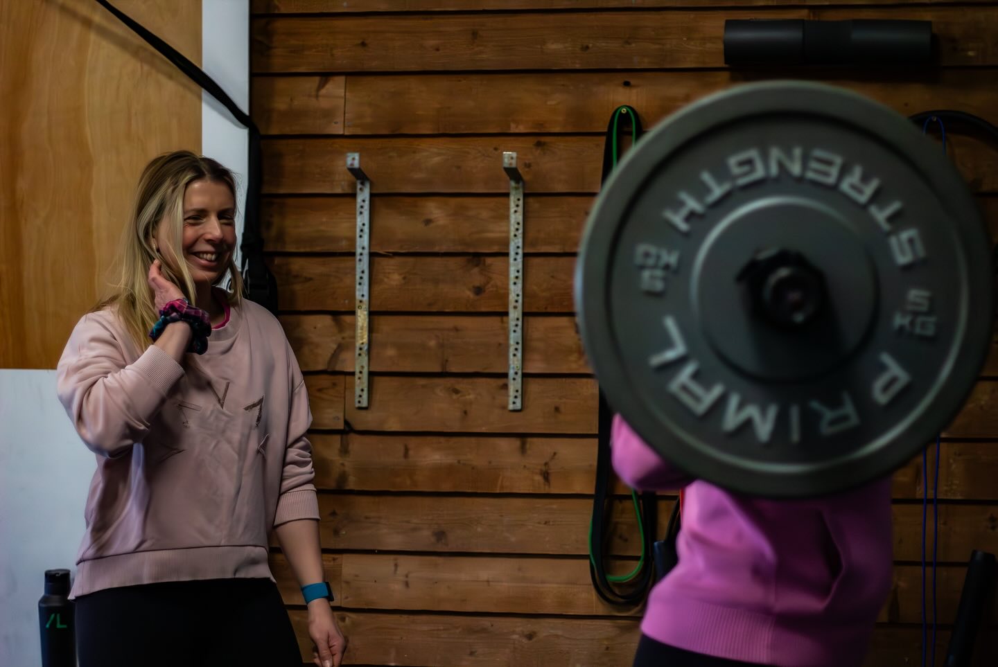 Joss coaching a lift in the barn