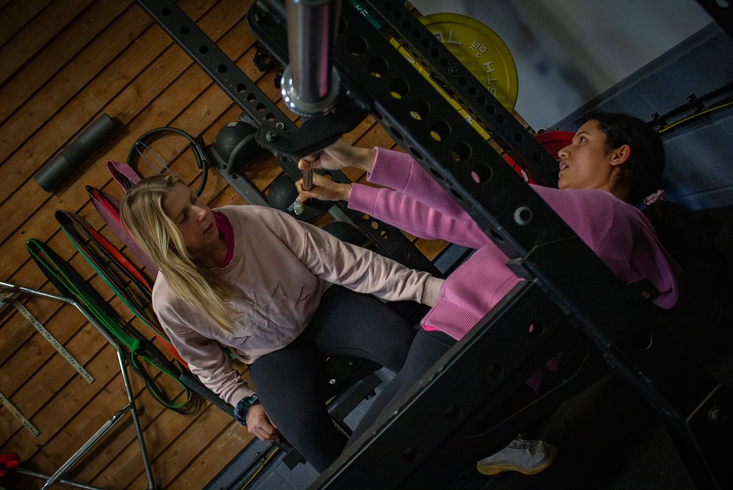 Joss coaching a client on the cable stack